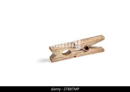 Old rusty wooden clothespin for drying clothes isolated on white background Stock Photo