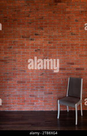 Grey sofa against brick wall in the room Stock Photo Alamy