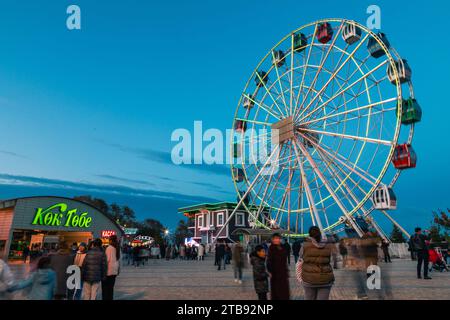 Almaty, Kazakhstan - April 28, 2023: Amusement park with Ferris Wheel on Kok-Tobe hill in Almaty city Stock Photo