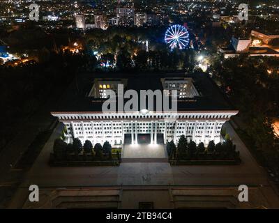 Bishkek, Kyrgyzstan - July 15, 2023: Aerial view of Jogorku Kenesh (Parliament) building of the Kyrgyz Republic. The White House of Kyrgyzstan at nigh Stock Photo