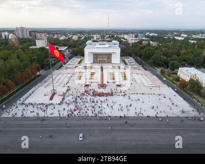 Bishkek, Kyrgyzstan - July 15, 2023: Aerial view of Bishkek city's Ala-Too central square with waving flag Stock Photo