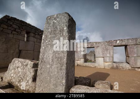 Windows and stone walls still stand in the ruins of Machu Picchu; Peru Stock Photo