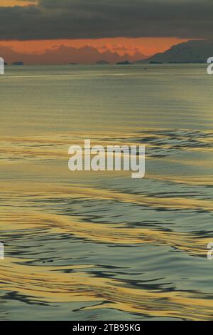 Ripples on the ocean in the Neumayer Channel at sunset; Antarctica Stock Photo