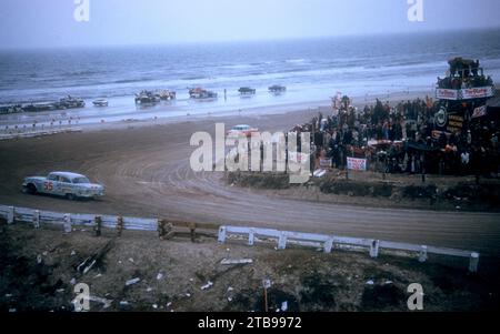 DAYTONA BEACH, FL - FEBRUARY 26: Junior Johnson in the Pontiac #55 car spins out as Lee Petty in the Dodge #42 car races along the beach during the Daytona Beach and Road Course on February 26, 1956 in Daytona Beach, Florida. (Photo by Hy Peskin) *** Local Caption *** Junior Johnson;Lee Petty Stock Photo