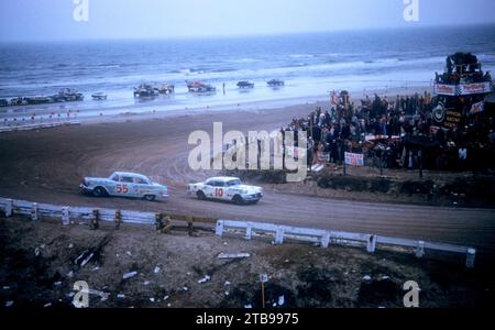 DAYTONA BEACH, FL - FEBRUARY 26: Junior Johnson in the Pontiac #55 car spins out as Jim Cushman in the Buick #10 car races past him during the Daytona Beach and Road Course on February 26, 1956 in Daytona Beach, Florida. (Photo by Hy Peskin) *** Local Caption *** Junior Johnson;Jim Cushman Stock Photo