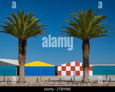 Colorful airplane hangars at Swakopmund airport; Swakopmund, Skeleton Coast, Namibia Stock Photo