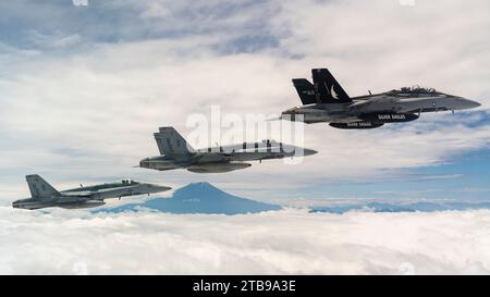 U.S. Marine Corps F/A-18 Hornet aircraft fly in formation near Mount Fuji, Japan, June 3, 2023. U.S. Marine Corps photo by Cpl. Tyler Harmon Stock Photo