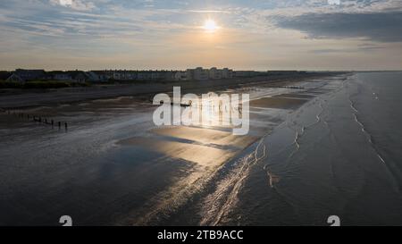 Bracklesham Bay on a sunny summer morning. Elevated view showing the great beach and seaside landscape. Groynes protecting the beach from erosion. Stock Photo