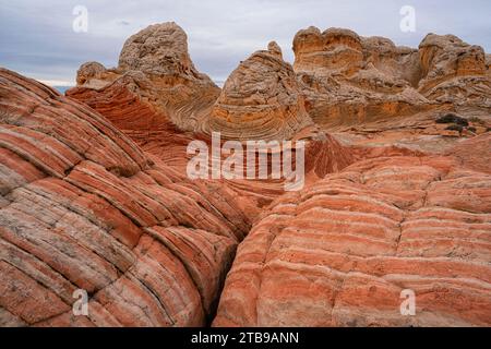 View of the eroded Navajo sandstone creating red rock formations that form alien landscapes with amazing lines, contours, patterns and shapes in th... Stock Photo