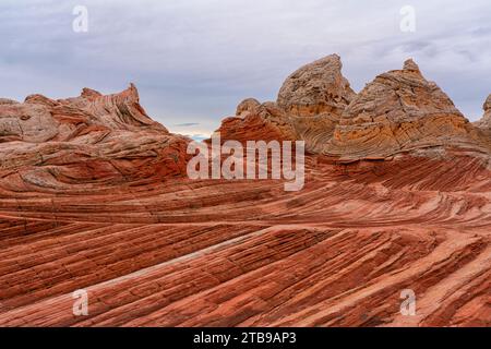 View of the eroded Navajo sandstone creating red rock formations with ridged, swirling patterns, forming alien landscapes with amazing lines, conto... Stock Photo