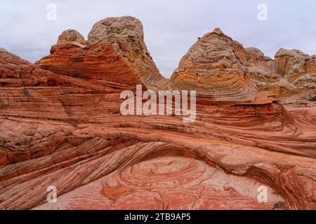 View of the eroded Navajo sandstone creating red rock formations with ridged, swirling patterns, forming alien landscapes with amazing lines, conto... Stock Photo