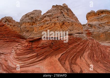 View of the eroded Navajo sandstone creating red rock formations with ridged, swirling patterns, forming alien landscapes with amazing lines, conto... Stock Photo