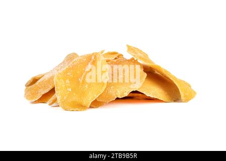 Heap of sliced dried mango isolated on white background. Copy space. Stock Photo