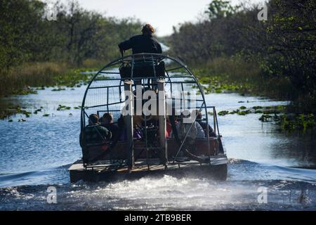 Tourists on an airboat ride in Everglades National Park, Florida; Florida, United States of America Stock Photo