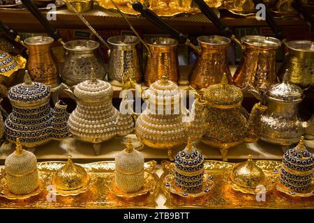 Decorative teapots for sale, brass, copper and bedazzeled with gems on display in a shop in the Spice Bazaar in the Fatih District; Istanbul, Turkey Stock Photo