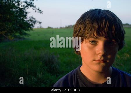 Outdoor portrait of a boy in sunset light; Walton, Nebraska, United States of America. Stock Photo