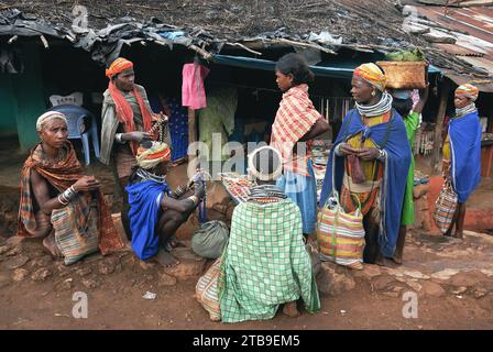 Bondas tribal people at the Ankudeli market. The Bonda, also known as Remo, are a Munda ethnic group who live in the isolated hill regions of the Malkangiri district of southwestern Odisha, near the junction of the three states of Odisha, Chhattisgarh, and Andhra Pradesh. The tribe is one of the oldest and most primitive in mainland India; their culture has changed little for more than a thousand years. They are one of the 75 Primitive Tribal Groups identified by the Government of India. Stock Photo