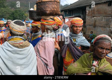 Bondas tribal people at the Ankudeli market. The Bonda, also known as Remo, are a Munda ethnic group who live in the isolated hill regions of the Malkangiri district of southwestern Odisha, near the junction of the three states of Odisha, Chhattisgarh, and Andhra Pradesh. The tribe is one of the oldest and most primitive in mainland India; their culture has changed little for more than a thousand years. They are one of the 75 Primitive Tribal Groups identified by the Government of India. Stock Photo