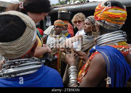 Bondas tribal people at the Ankudeli market. The Bonda, also known as Remo, are a Munda ethnic group who live in the isolated hill regions of the Malkangiri district of southwestern Odisha, near the junction of the three states of Odisha, Chhattisgarh, and Andhra Pradesh. The tribe is one of the oldest and most primitive in mainland India; their culture has changed little for more than a thousand years. They are one of the 75 Primitive Tribal Groups identified by the Government of India. Stock Photo