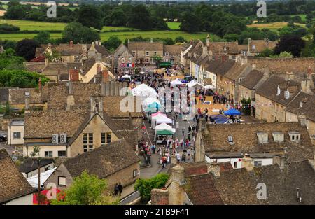 Annual Boules competition held  in Sherston. View of the games in the wide High Street from the top of the church tower. Stock Photo