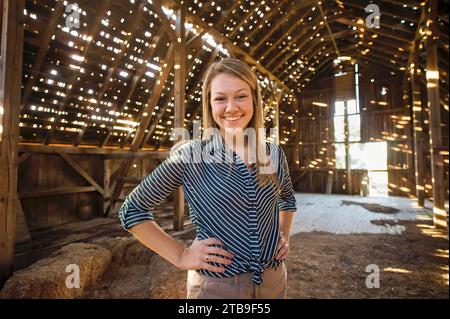 Portrait of a teenage girl in an old barn; Dunbar, Nebraska, United States of America Stock Photo