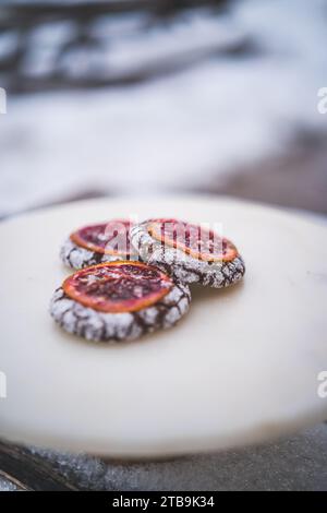 A white plate with freshly-baked donuts arranged in a circular pattern, ready to be served Stock Photo