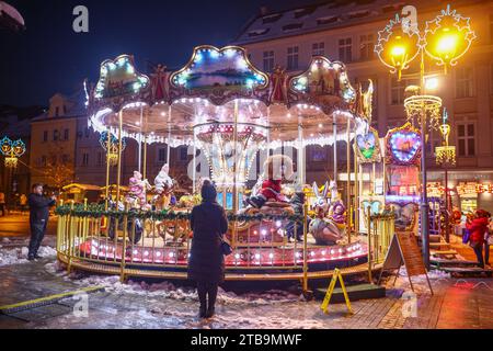 Gliwice, Poland. 5th Dec, 2023. Old fashioned French carousel and Christmas decorations are seen during Christmas market at the main square in Gliwice, Poland on December 5, 2023. (Credit Image: © Beata Zawrzel/ZUMA Press Wire) EDITORIAL USAGE ONLY! Not for Commercial USAGE! Credit: ZUMA Press, Inc./Alamy Live News Stock Photo