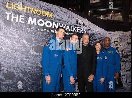 Tom Hanks (centre) arrives for the The Moonwalkers at Lightroom King's Cross in London. Offering a perspective on humankind's past and future voyages to the moon, Lightroom's projection and audio technology transforms the space into a vehicle for an immersive voyage. Picture date: Tuesday December 5, 2023. Stock Photo