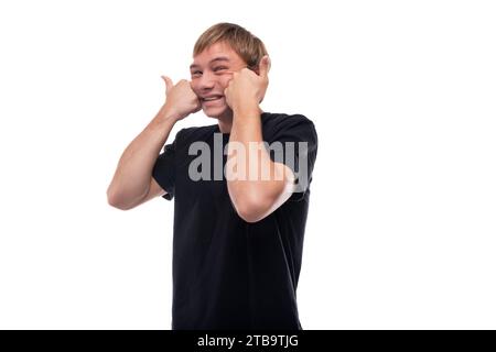 Portrait of an emotional teenage guy with brown hair Stock Photo
