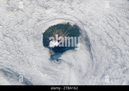 View from space of Atlasov Island rising above the clouds and the Sea of Okhotsk. Stock Photo