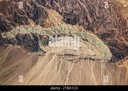 View from space showing a small semicircular mountain in the Dasht-e Kavir Desert, Iran. Stock Photo