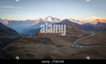 Aerial shot of mountain pass with curving road and beautiful mountains in backdrop, Dolomites, Italy Stock Photo