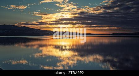Evening sunset over an estuary Stock Photo