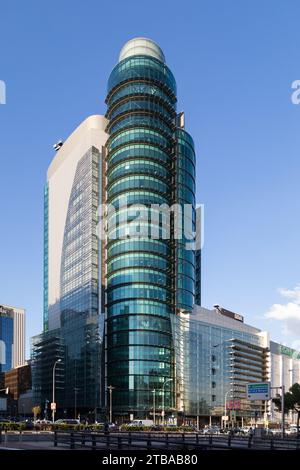Low-angle view of a modern skyscraper (Torre Titania) in the AZCA Business district in Madrid, Spain. Stock Photo
