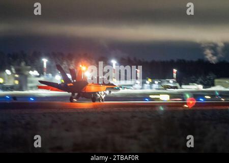 November 16, 2023 - Tampere-Pirkkala Air Base, Finland - A U.S. Marine Corps F/A-18 Hornet assigned to Marine All Weather Fighter Attack Squadron (VMFA(AW)) 224 arrives at Tampere-Pirkkala Air Base, Finland, to participate in exercise Freezing Winds 23, November 16, 2023. FW23 is a Finnish-led maritime exercise in which United States Marines assigned to Marine Rotational Force- Europe, and U.S. Navy Forces Europe takes part. The exercise serves as a venue to increase Finnish Navy readiness and increase U.S., Finland, and NATO partners and Allies interoperability in operational logistics, integ Stock Photo