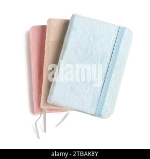 Stack of different notebooks isolated on white background Stock Photo