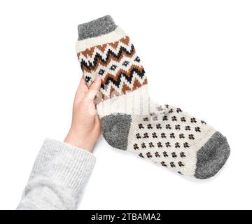 Woman with warm socks on white background Stock Photo
