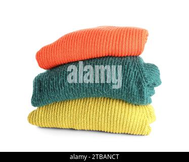 Stack of new different stylish sweaters on white background Stock Photo ...