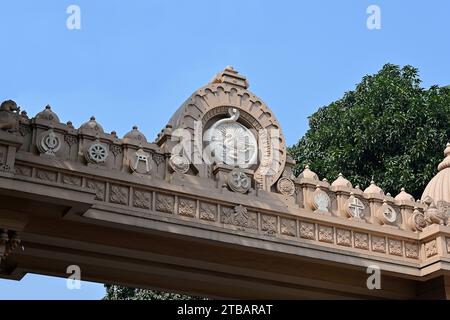 The entrance gate of Belur Math, the headquarters of the Ramakrishna Math and Ramakrishna Mission, with symbols of the major world religions Stock Photo