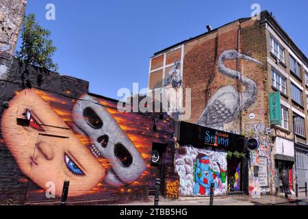 Colourful street art and graffiti in Hanbury Street at Brick Lane in Spitalfields, Tower Hamlets, London, England, UK Stock Photo