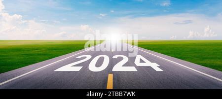 The new year 2024 or straightforward concept. Text 2024 written on the highway road. planning and challenge, new business, business strategy. Stock Photo