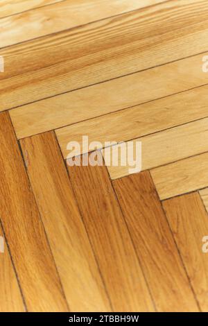 Wooden parquet floor background. Old vintage parquet on the floor in the living room. Interior design concept. High quality photo Stock Photo