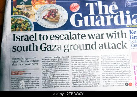 'Israel to escalate war with south Gaza ground attack' Guardian newspaper headline front page Israel-Hamas war article 2 December 2023 London UK Stock Photo