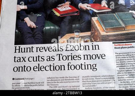 Jeremy 'Hunt reveals £20bn in tax cuts as Tories move onto election footing' Guardian newspaper headline British economy 21 November 2023 London UK Stock Photo