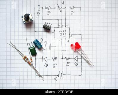 Electronic components on hand drawn circuit diagram. Selected focus. Stock Photo