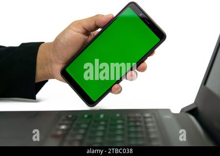 Man's hand shows mobile smartphone with white screen. Isolated on white background. Mock up mobile Stock Photo
