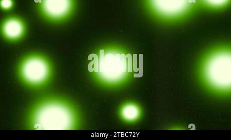 Green, yellow and black spheres gradient grainy background. Illuminated shiny specks in green yellow tones. Noise texture effect. Stock Photo