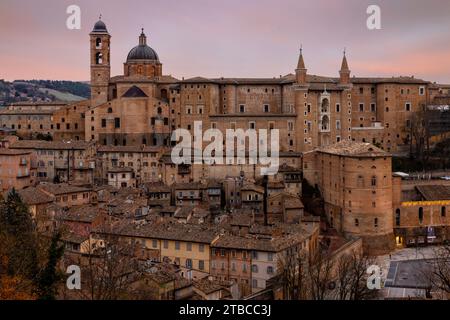 A panoramic view of Urbino, a gem of the Renaissance, perched atop a hill amidst the verdant countryside of Marche, Italy. Stock Photo