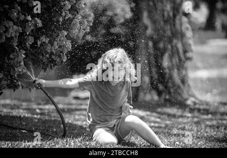 Wall mounted hose reel Black and White Stock Photos & Images - Alamy