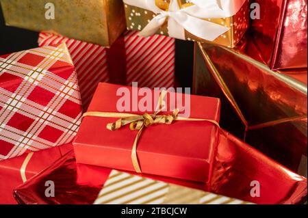 A lot of wrapped Christmas gift boxes. Red, white and golden color Stock Photo